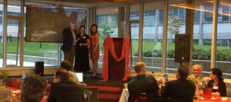 Heidi Yang and Su-In Kuah present $10,000 cheque to Dr. Englezos.