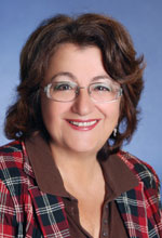 Rabab Ward smiling at the camera