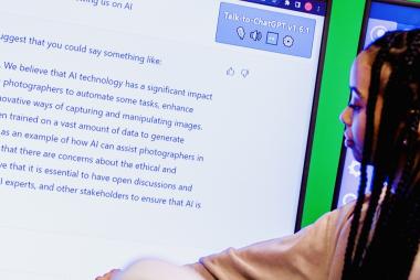 Girl stands in front of screen of text