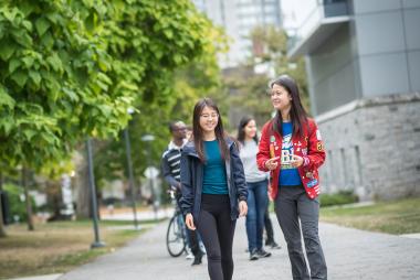 Engineering students walking and talking.