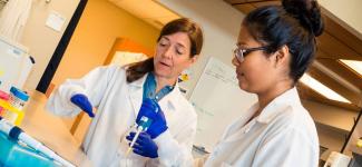 Dr. Manon Ranger and a colleague in the lab. Photo credit: Clare Kiernan.