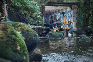 UBC environmental engineering students taking a reading in an urban creek.