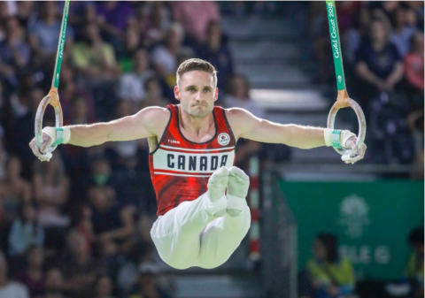 Zack Eberwein on the rings competing at the Olympics